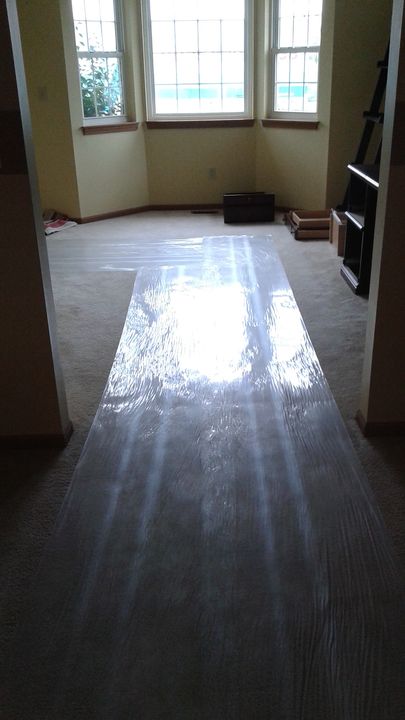 Hallway floor covered with a protective runner (Full Service Moving) by Moving Pros CLE