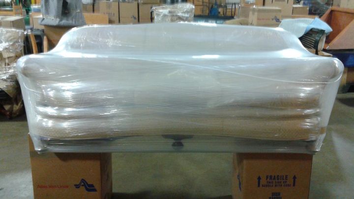Furniture shrink-wrapped and padded for a move (Full Service Moving) by Moving Pros CLE