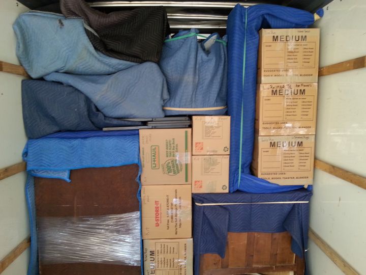 Moving truck packed with boxes and padded furniture (Full Service Moving) by Moving Pros CLE