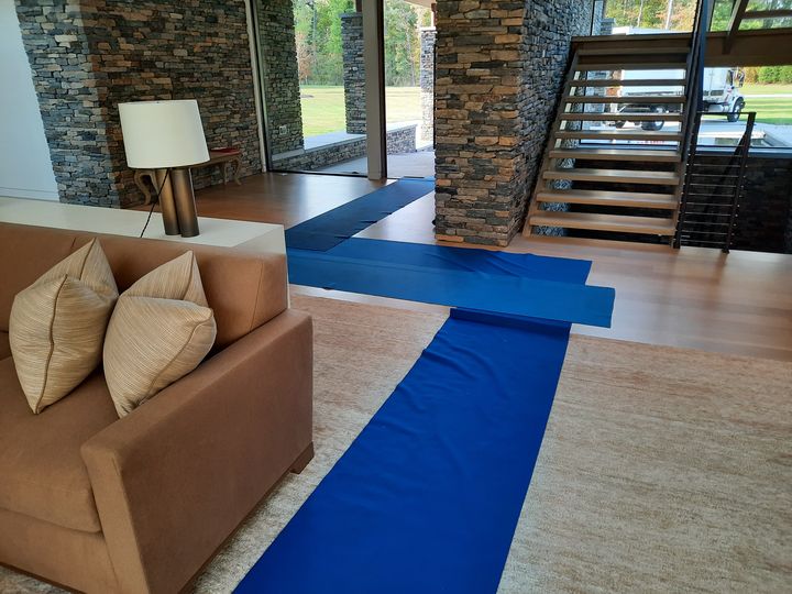 Floor runners protecting a living room floor (Full Service Moving) by Moving Pros CLE